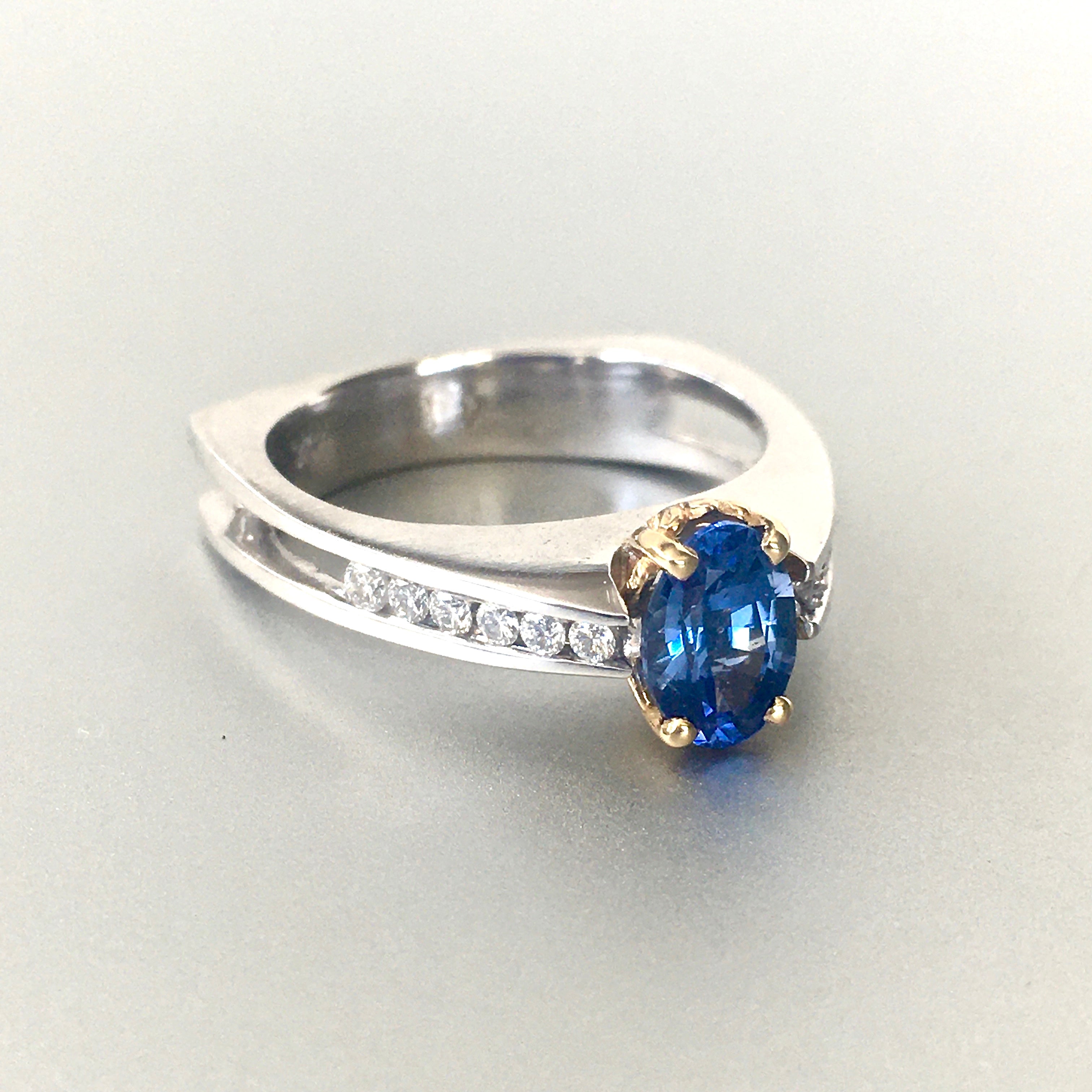Three Stone Oval Blue Sapphire Ring with Prong and Channel Set Round Side  Diamonds (4.32cttw) AAAA Quality